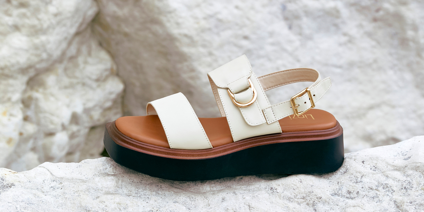 wide fit loafer shoe on rocks