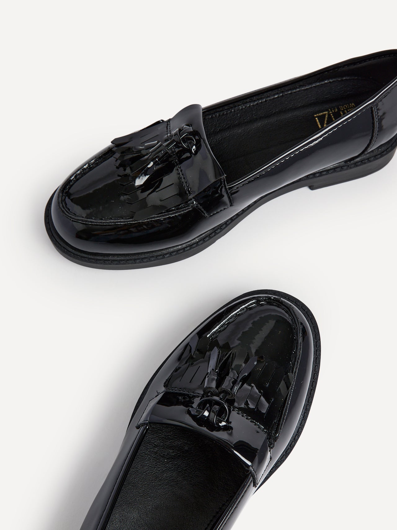Wide Fit Black Patent Loafer With Front Tassel And Fringing Detail