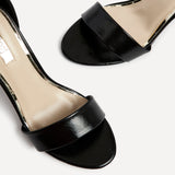 Nelly Black Faux Leather Barely There Heels