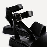 Nora Black Faux Leather Flat Sandals